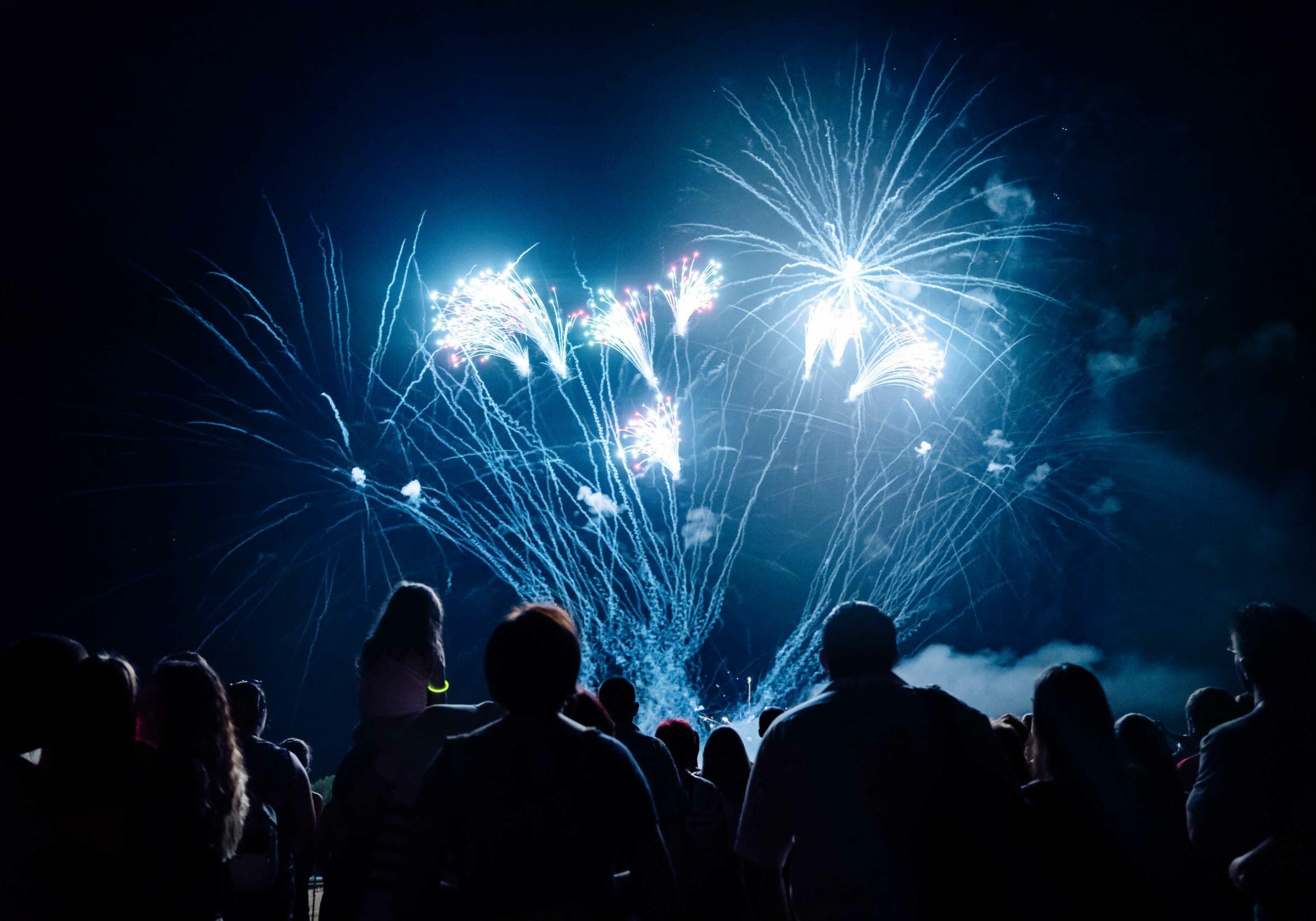 Crowd watching fireworks and celebrating new year eve